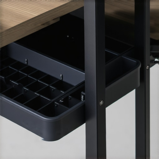 Close-up view of a plastic cable tray with compartments under a desk.