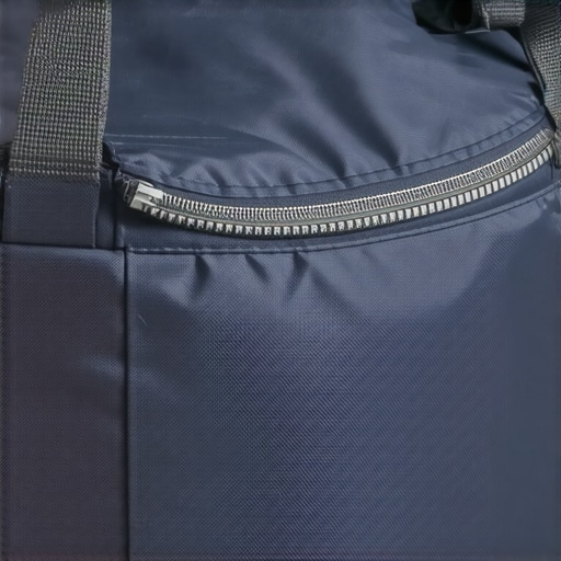 Detailed view of a sealed, heavy-duty nylon sandbag with reinforced stitching