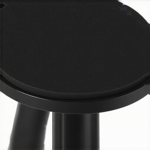 Detail of rubber pad on tripod plate demonstrating textured surface and grip
