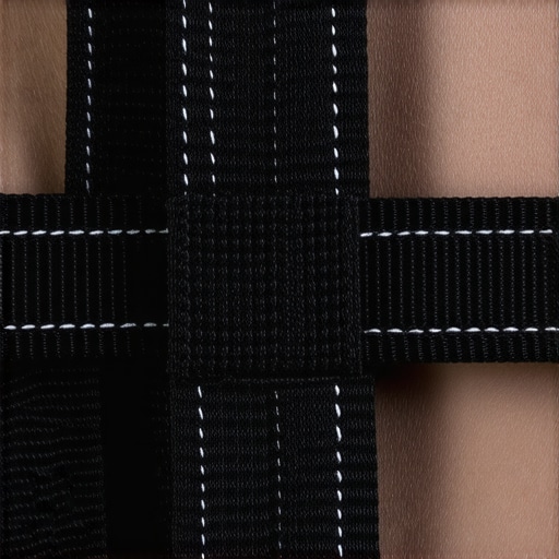 Detailed view of a nylon Velcro cable strap's stitching and fastening system.