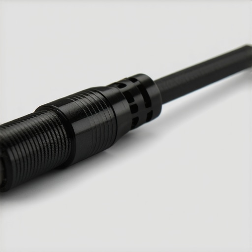Close-up of a ferrite core installed on a mic cable using the double loop technique for maximum EMI suppression.
